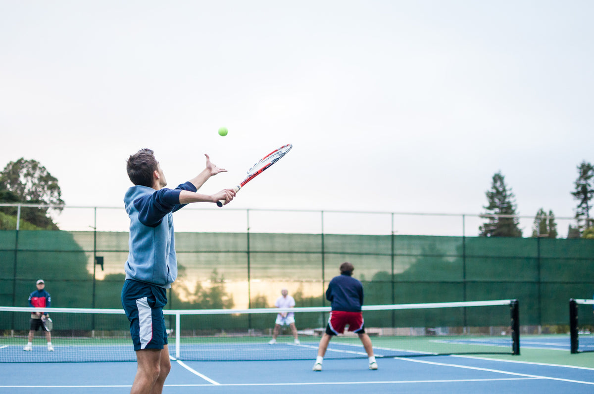 Group of men playing tennis